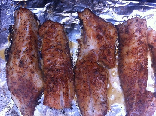 Grilled trout basted with lemon butter