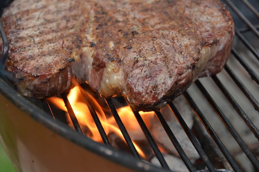 Steak over hot charcoal